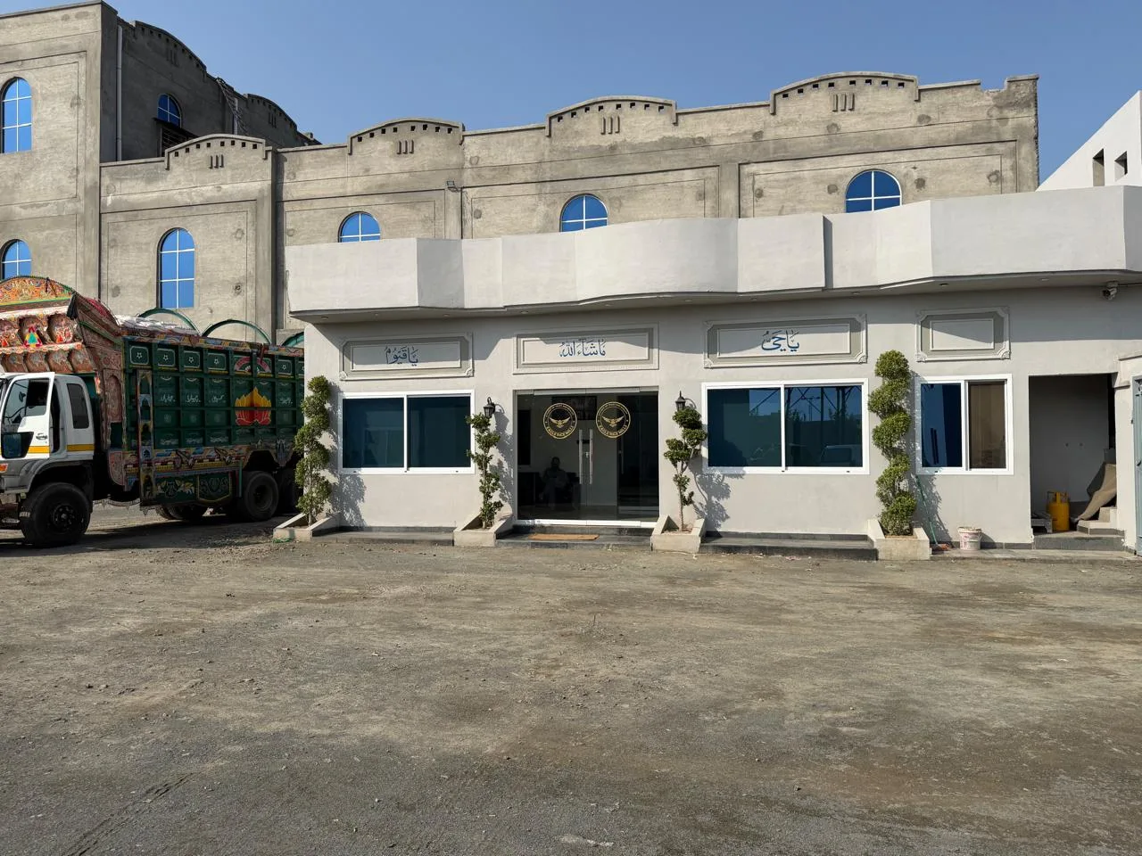 Exterior of Eagle Rice Mills with a transport vehicle